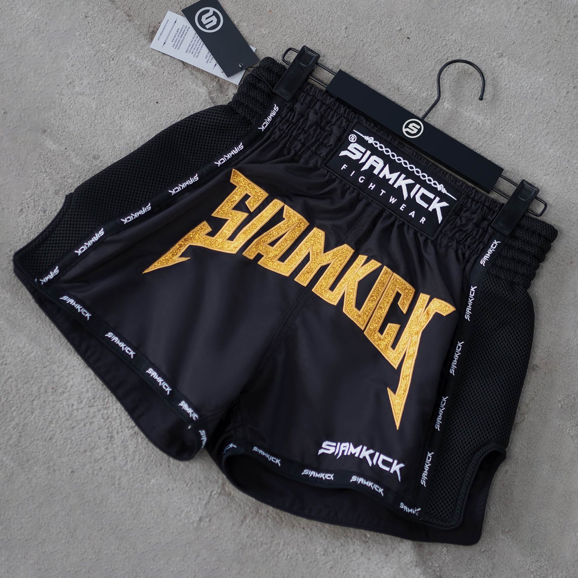 black and gold muay thai shorts