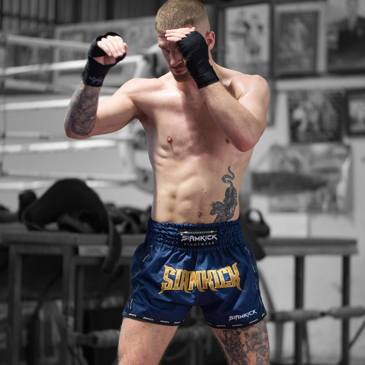 Model training in Commander Navy Warpath Muay Thai shorts, size L on a 181cm 74kg frame