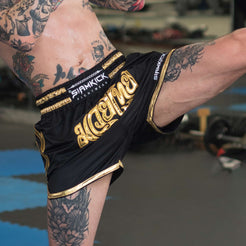 classic black and gold muay thai shorts